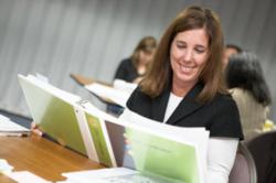 Woman Reading DISC Certification Manual
